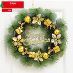 Christmas wreath with gold decorations and 'Merry Christmas' text on a white background
