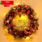 Decorative Christmas wreath with lights and ornaments on a yellow background