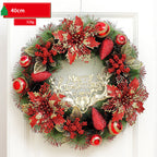 Decorative Christmas wreath with red and gold flowers on a white background