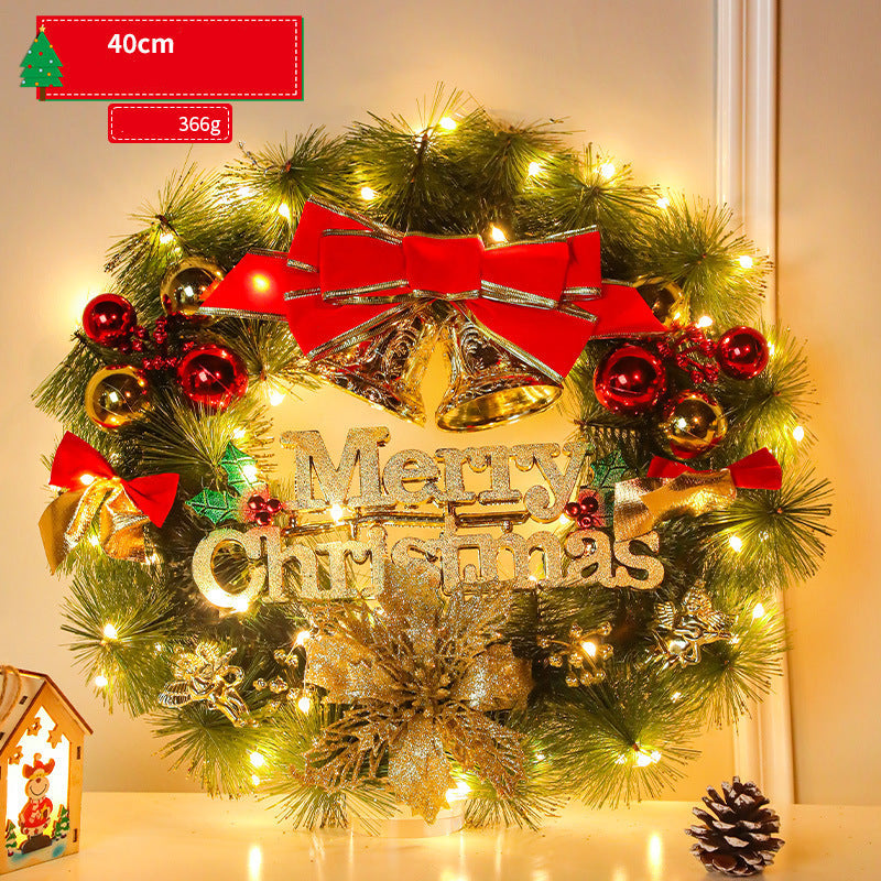 Christmas wreath with lights, red bow, and 'Merry Christmas' sign on a neutral background