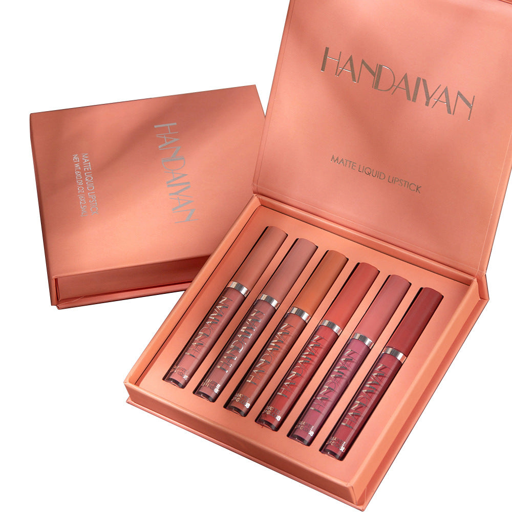 Set of matte liquid lipsticks in a rose gold box.