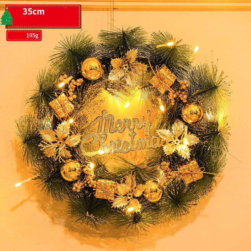 Decorative Christmas wreath with lights and 'Merry Christmas' text on a beige background