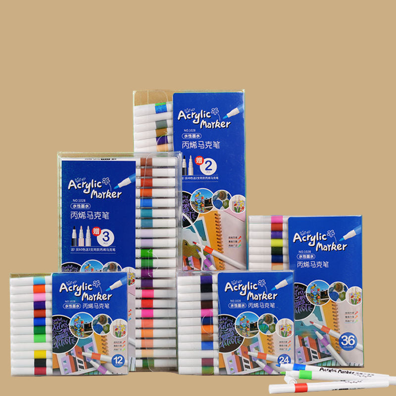 Acrylic marker sets with packaging on a beige background