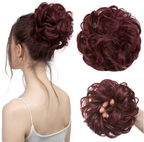 Maroon hair bun extension displayed on a mannequin and held in a hand against a white background.