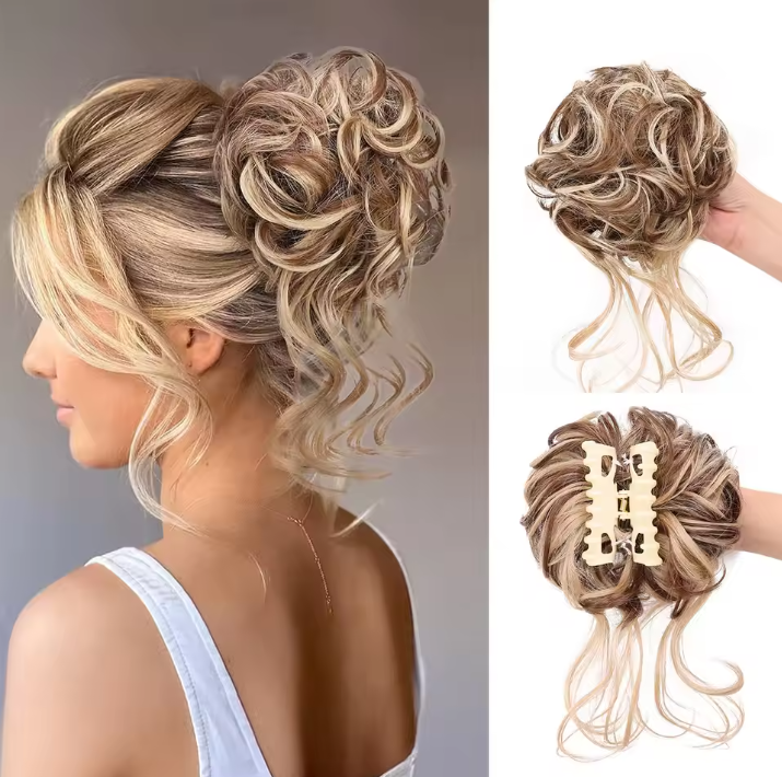 Woman with styled hair and two hair extensions on a plain background