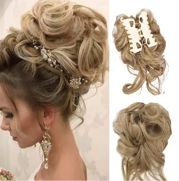 Blonde hairpiece styled in an updo with decorative elements on a white background