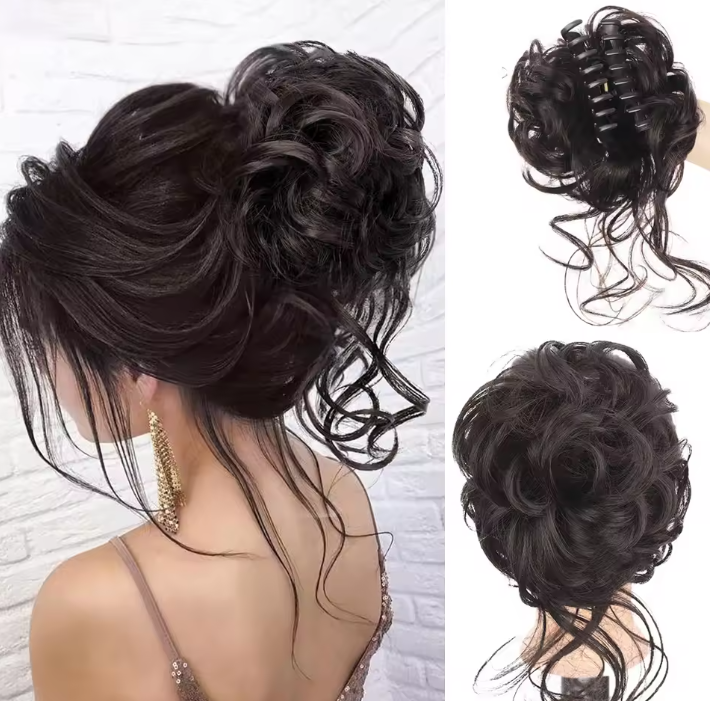 Black hair bun extension styled in an updo with a white brick wall background