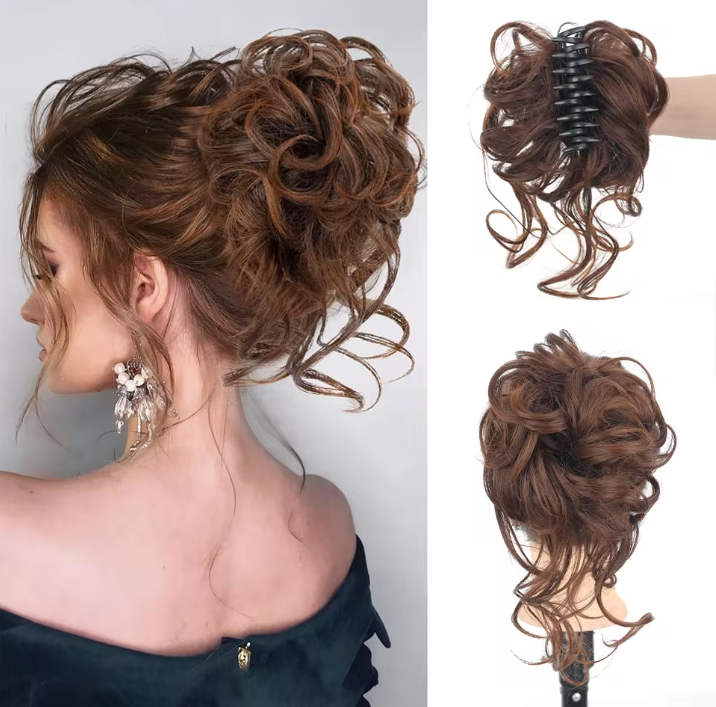Woman with styled hair and two hair extensions on a mannequin head.